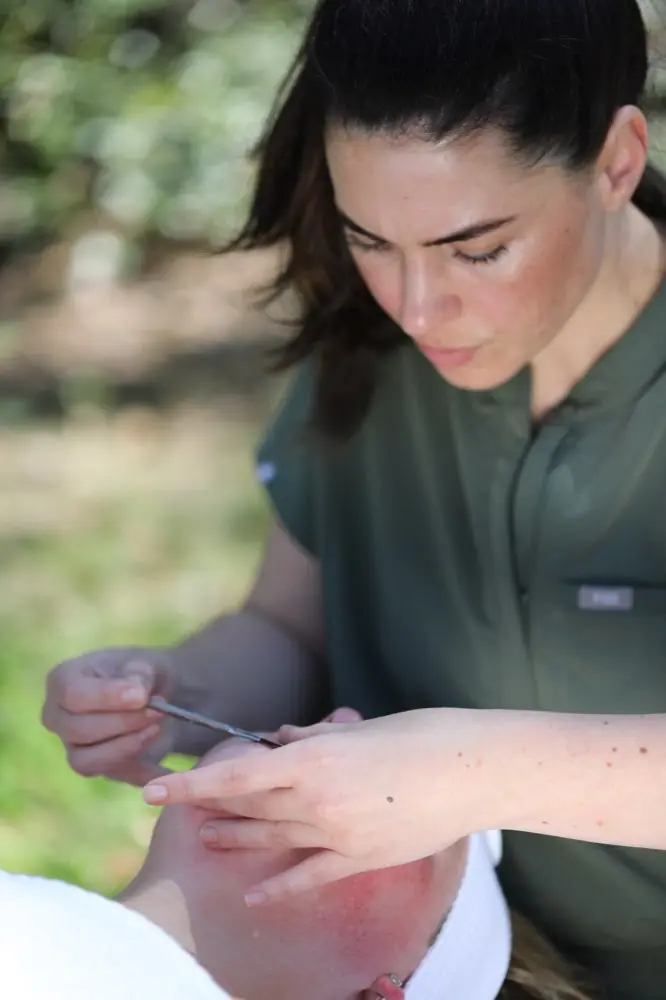 Ariel performing a dermaplane treatment