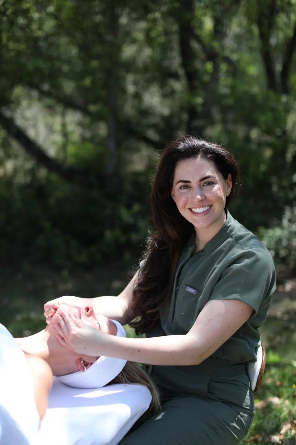 Ariel smiling while giving a facial